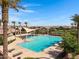 A sparkling community pool with lounge chairs and shaded areas, surrounded by lush landscaping and palm trees at 4332 E Boston St, Gilbert, AZ 85295