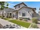Attractive exterior showcasing manicured yard, covered porch, and lovely design elements of the home at 4332 E Boston St, Gilbert, AZ 85295