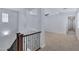 Upstairs hallway with carpeted floors and a view of the living space and bedrooms at 4332 E Boston St, Gilbert, AZ 85295