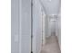 Bright hallway with multiple doorways and neutral paint, leading to various rooms within the home at 4332 E Boston St, Gilbert, AZ 85295
