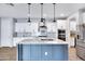 Kitchen features granite countertops, stainless steel appliances, and a central island with lighting at 4332 E Boston St, Gilbert, AZ 85295