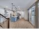 Bright, open kitchen with a central island, modern appliances, and wood-look flooring at 4332 E Boston St, Gilbert, AZ 85295