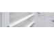 A close-up view of a built-in storage area with white shelves and a white door at 4332 E Boston St, Gilbert, AZ 85295