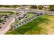 Bird's-eye view showcasing the outdoor recreation facility with shaded pods along a putting green at 4502 W Continental Dr, Glendale, AZ 85308