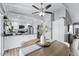 Dining space with view of kitchen, featuring white cabinets and stainless steel appliances at 4502 W Continental Dr, Glendale, AZ 85308