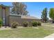 Townhouse exterior featuring private patios, desert landscaping, and well-maintained yards under a clear blue sky at 4502 W Continental Dr, Glendale, AZ 85308
