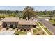This aerial picture highlights the townhome's exterior, private patio, and the scenic views of the nearby golf course and lake at 4502 W Continental Dr, Glendale, AZ 85308