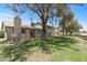 Exterior view of a well-maintained home with a fenced yard and mature trees at 4502 W Continental Dr, Glendale, AZ 85308