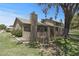 Exterior view of a well-maintained home with a fenced yard and mature trees at 4502 W Continental Dr, Glendale, AZ 85308