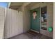 Inviting front entrance featuring a decorated teal door, a welcome mat, and a Central Security Group sign at 4502 W Continental Dr, Glendale, AZ 85308