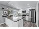 Kitchen featuring an island, stainless steel appliances, and modern cabinetry with lots of storage at 4502 W Continental Dr, Glendale, AZ 85308