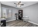 Office featuring neutral walls, ceiling fan, wood-look floors, bookcase, and a music stand at 4502 W Continental Dr, Glendale, AZ 85308