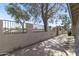 Wide patio featuring privacy walls and mature tree at 4502 W Continental Dr, Glendale, AZ 85308