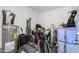 A cluttered storage room with a hot water heater and a variety of items at 4502 W Continental Dr, Glendale, AZ 85308