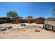 Beautiful backyard featuring wood bridge, stone accents, and spacious patio at 4516 E Willow Ave, Phoenix, AZ 85032