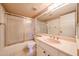 Cozy bathroom with pink sink and shower/bath combination at 4516 E Willow Ave, Phoenix, AZ 85032
