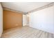 Bedroom featuring fresh, neutral walls, light wood flooring, and an open doorway at 4516 E Willow Ave, Phoenix, AZ 85032