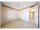 Bedroom with ceiling fan, closet, and door leading to the hallway at 4516 E Willow Ave, Phoenix, AZ 85032
