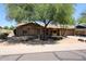 Charming single-story brick home featuring mature shade trees and a low maintenance front yard at 4516 E Willow Ave, Phoenix, AZ 85032