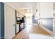 Galley kitchen featuring white cabinets, black appliances, and a cozy breakfast nook at 4516 E Willow Ave, Phoenix, AZ 85032