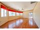 Spacious living room with abundant windows and hardwood flooring at 4516 E Willow Ave, Phoenix, AZ 85032