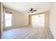 An open-concept living space features wood look flooring and a ceiling fan at 4516 E Willow Ave, Phoenix, AZ 85032