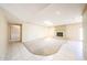 Open living room featuring fireplace, skylight, and tile flooring at 4516 E Willow Ave, Phoenix, AZ 85032
