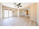 An open concept living space featuring a ceiling fan and wood look flooring at 4516 E Willow Ave, Phoenix, AZ 85032