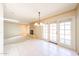 An open concept living space featuring a brick fireplace and French doors at 4516 E Willow Ave, Phoenix, AZ 85032