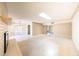 Expansive living room with fireplace, skylight, and open access to kitchen at 4516 E Willow Ave, Phoenix, AZ 85032