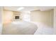 Spacious living room with fireplace, neutral carpet, tile, and access to the backyard at 4516 E Willow Ave, Phoenix, AZ 85032