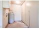 Spacious storage room with clean, white cabinets and water heater at 4516 E Willow Ave, Phoenix, AZ 85032