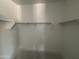 A large walk-in closet with ample storage shelving and space at 46869 W Old Timer Rd, Maricopa, AZ 85139