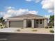 Charming single-story home with a two-car garage and xeriscaped front yard under a beautiful sky at 46869 W Old Timer Rd, Maricopa, AZ 85139