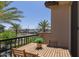 Inviting balcony featuring a wooden table and chairs, perfect for outdoor relaxation at 4711 S Vapor --, Mesa, AZ 85212