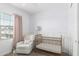 Charming Bedroom with a crib, glider, and soft lighting at 4711 S Vapor --, Mesa, AZ 85212
