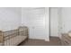 Charming Bedroom featuring a golden crib and white closet doors, perfect for a cozy space at 4711 S Vapor --, Mesa, AZ 85212