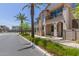View of the townhome's exterior highlighting its stucco finish, balconies, and landscaping at 4711 S Vapor --, Mesa, AZ 85212