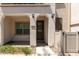 Inviting front entrance with a decorative wreath, covered porch, and landscaped surroundings at 4711 S Vapor --, Mesa, AZ 85212