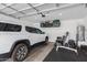 Well-organized garage featuring a car, storage racks, and fitness equipment at 4711 S Vapor --, Mesa, AZ 85212