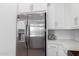Modern kitchen featuring stainless steel appliances, white cabinets, light countertops and tile backsplash at 4711 S Vapor --, Mesa, AZ 85212