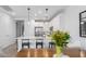 Bright kitchen with white cabinetry, stainless steel appliances, and a breakfast bar at 4711 S Vapor --, Mesa, AZ 85212