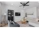 Cozy living room with stylish furniture, a wall-mounted TV, and ample natural light at 4711 S Vapor --, Mesa, AZ 85212