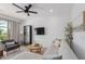 Bright living room featuring modern furniture, a ceiling fan, and balcony access at 4711 S Vapor --, Mesa, AZ 85212