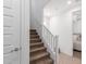 Staircase with carpeted steps and white railing, leading to the upper level of the home at 4711 S Vapor --, Mesa, AZ 85212
