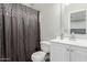Cozy bathroom featuring a decorative shower curtain and a vanity with a sink at 4741 N 85Th Ave, Phoenix, AZ 85037