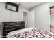 A secondary bedroom has neutral walls, laminate floors, and access to a closet at 4741 N 85Th Ave, Phoenix, AZ 85037