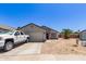 Charming single-story home with a two-car garage and desert landscaping at 4741 N 85Th Ave, Phoenix, AZ 85037
