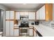 Modern kitchen featuring stainless steel appliances and white cabinetry at 4741 N 85Th Ave, Phoenix, AZ 85037