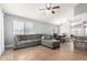 Open living room layout with a large sofa and dining area, great for hosting at 4741 N 85Th Ave, Phoenix, AZ 85037